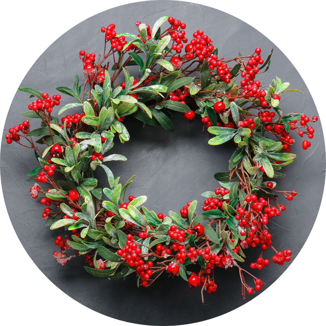 A wreath made of green leaves and red berries